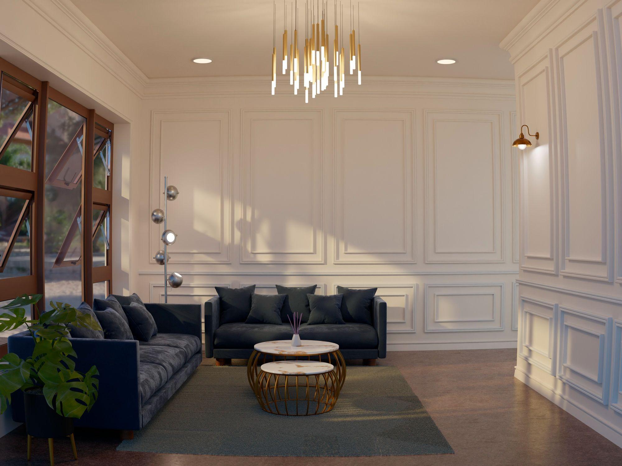 Panelled salon with charcoal sofas and a cascading brass pendant