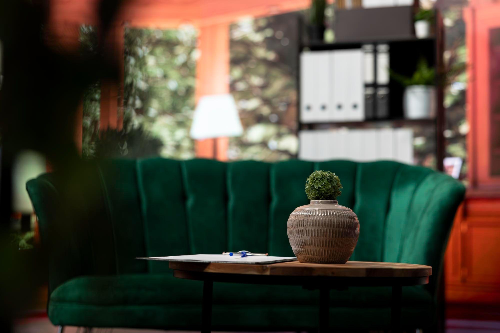 Emerald velvet sofa in warm evening light