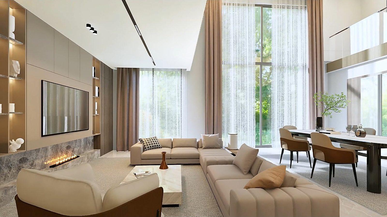 Open plan villa living room with floor to ceiling windows and a stone fireplace